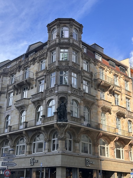 Historic ornate building facade blue sky