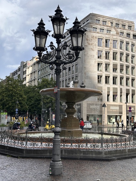 Ornate wrought-iron street lamps in plaza