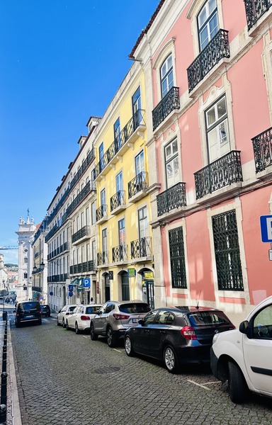 Colorful Lisbon buildings on a cobblestone street