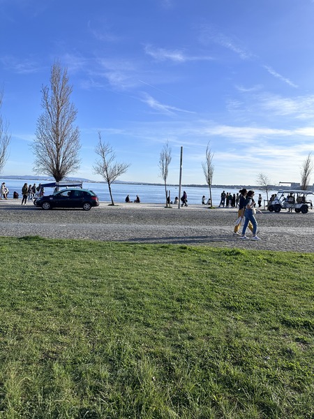 Riverside promenade with people