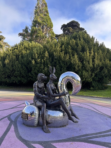 Sculpture with reflecting sphere in park